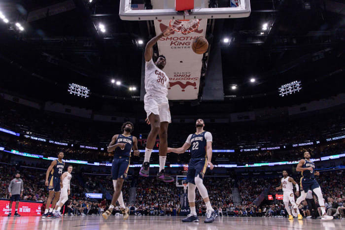 Mar 13, 2024; New Orleans, Louisiana, USA; Cleveland Cavaliers center Damian Jones (30) drives to the basket against New Orleans Pelicans forward Larry Nance Jr. (22) during the second half at Smoothie King Center. Mandatory Credit: Stephen Lew-USA TODAY Sports